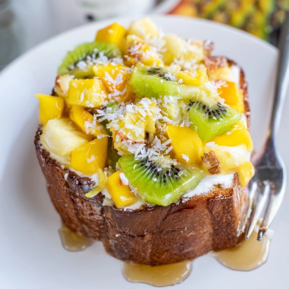 Creamy yogurt-custard toast topped with fresh tropical fruits and coconut flakes.  