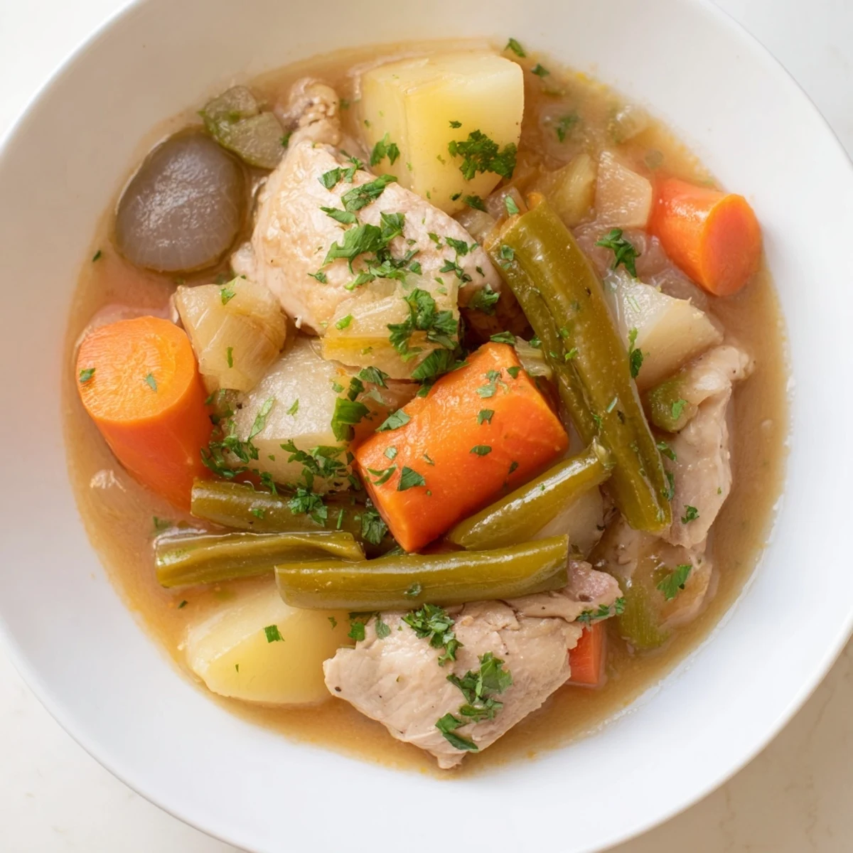 Enjoy a rich and flavorful Slow-Cooker Chicken & Vegetable Stew, perfect for a cozy weeknight meal.