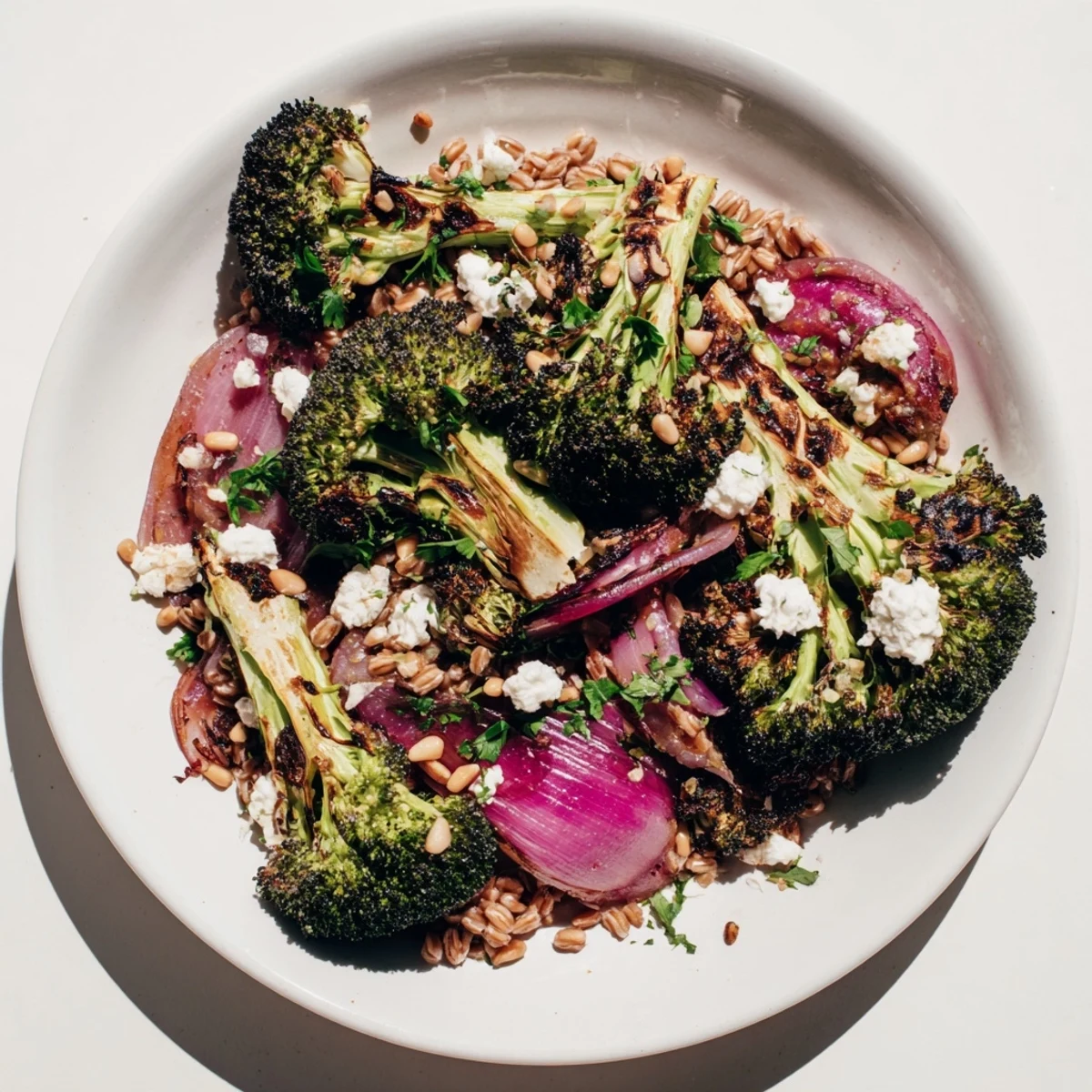 Golden roasted broccoli with garlic-lemon dressing topping a bed of nutty farro, delicious.