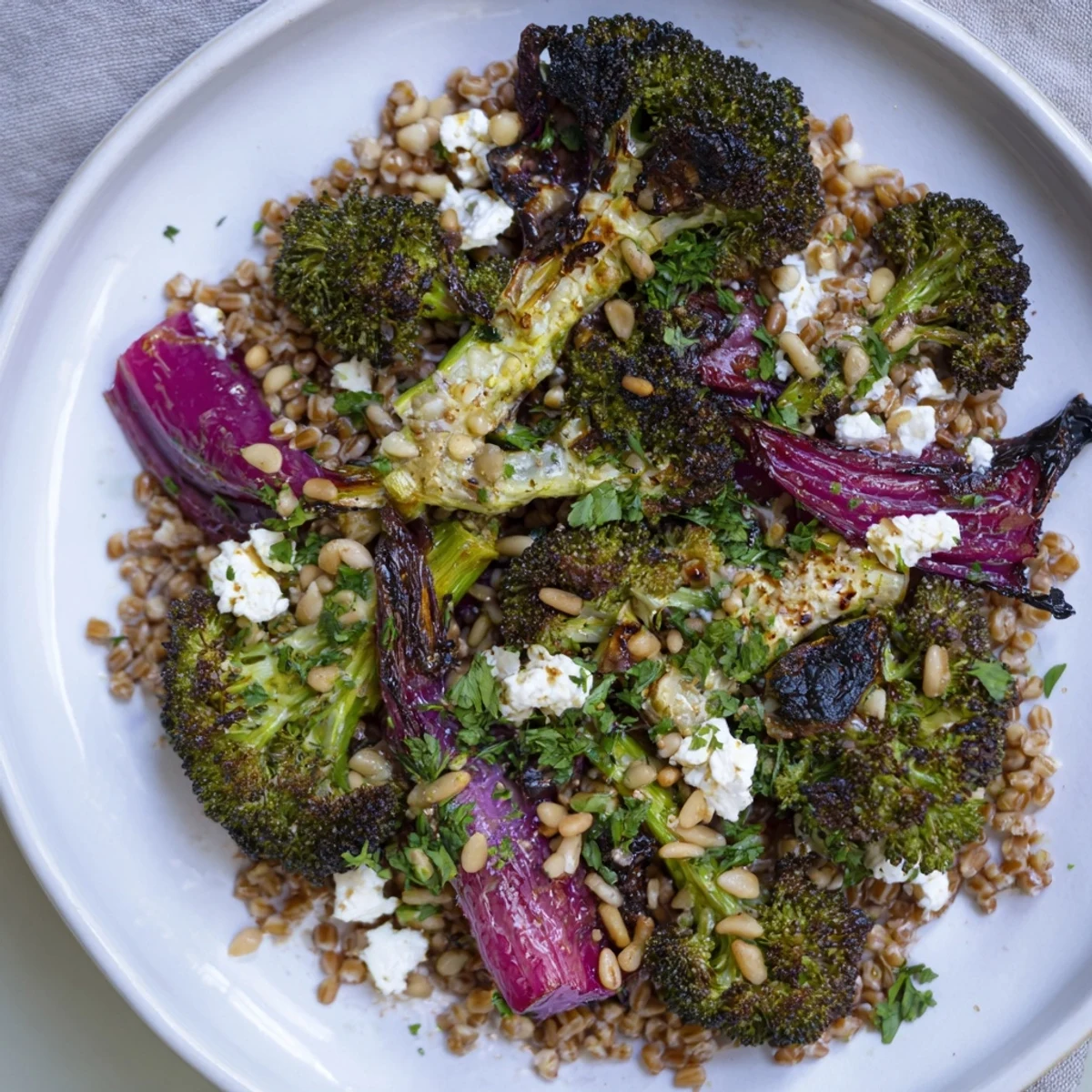 Close-up of Warm Roasted Broccoli with vibrant colors served over farro, smelling fresh and zesty.