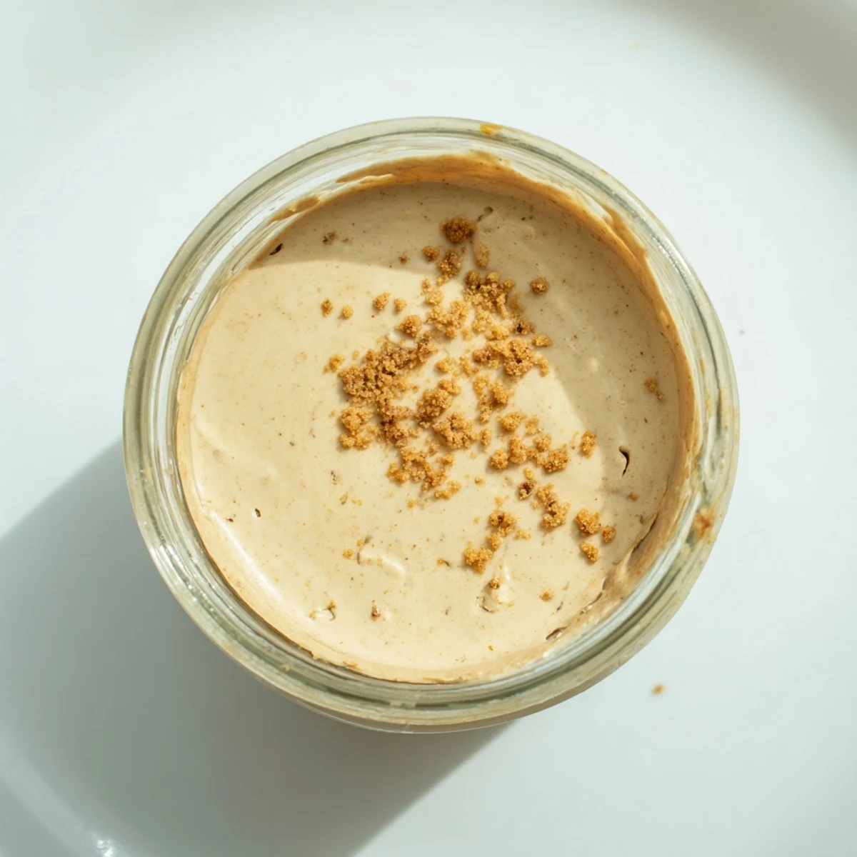 Freshly made Quick Christmas Cookie Butter Spread, smelling of warm spices, swirled in a glass jar.