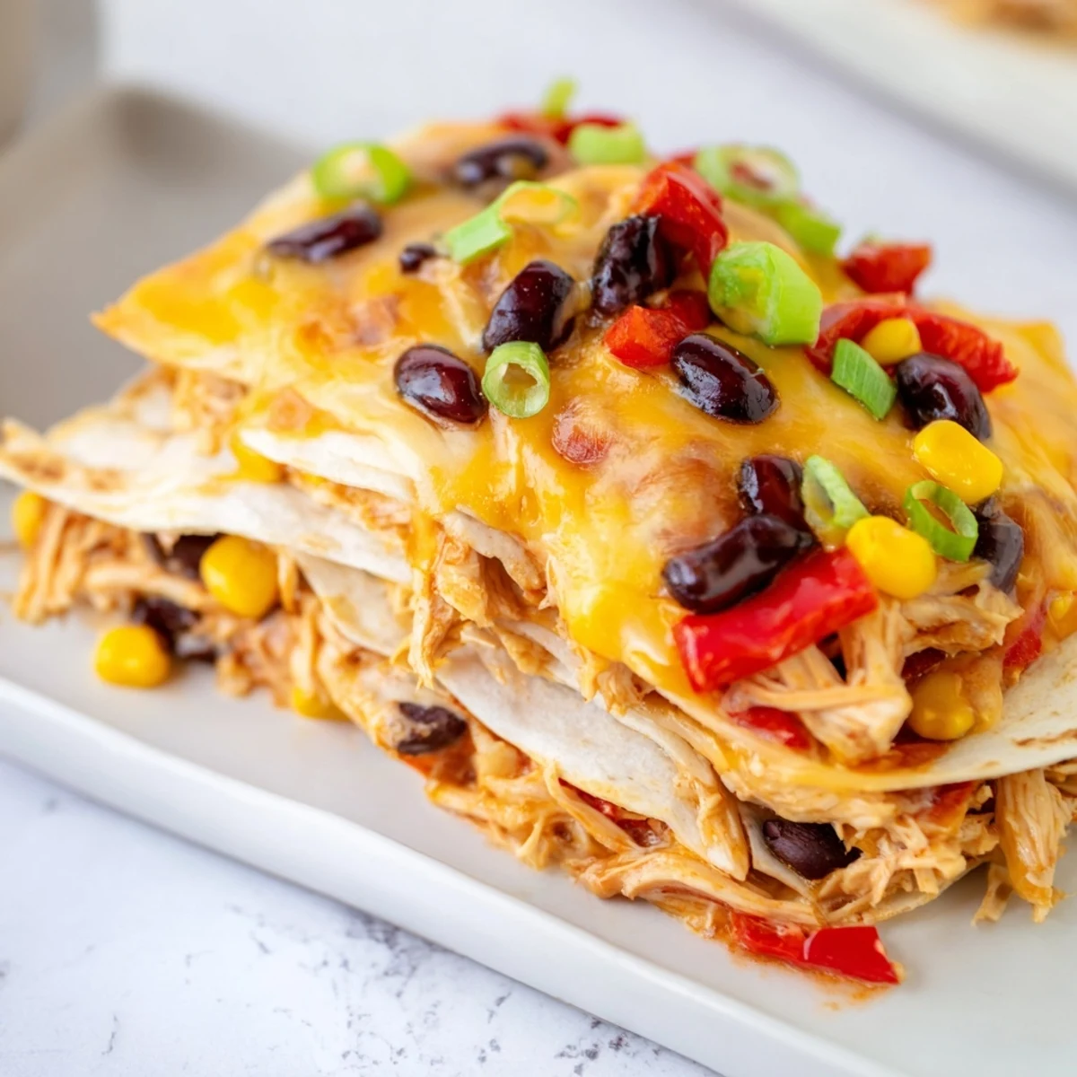 Freshly baked Taco Bell Copycat Chicken Bake, ready to eat with a bubbling cheese topping and golden tortillas.