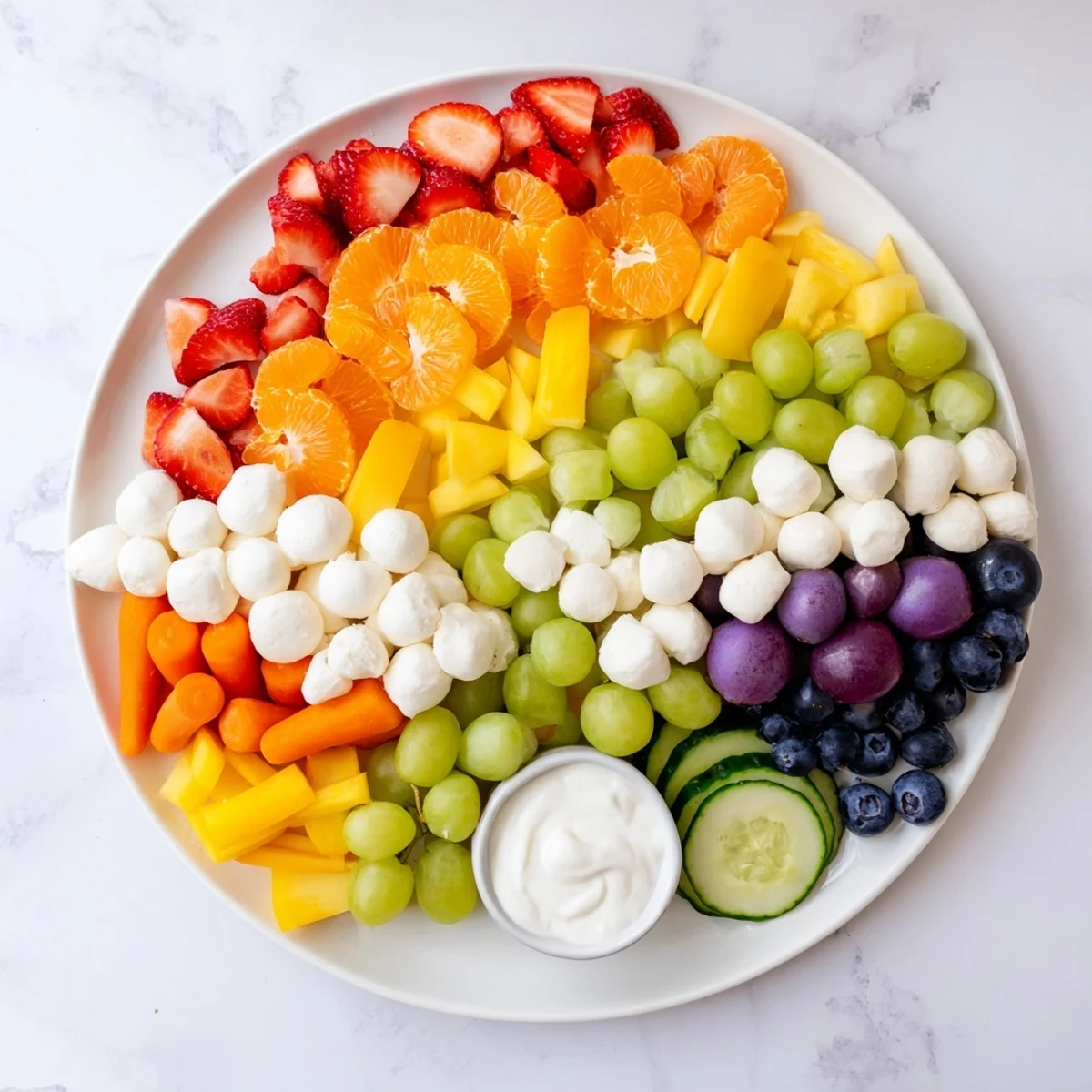 Brightly colored Rainbow Cloud Snack Board, a visually delightful platter of fresh, tasty fruits.