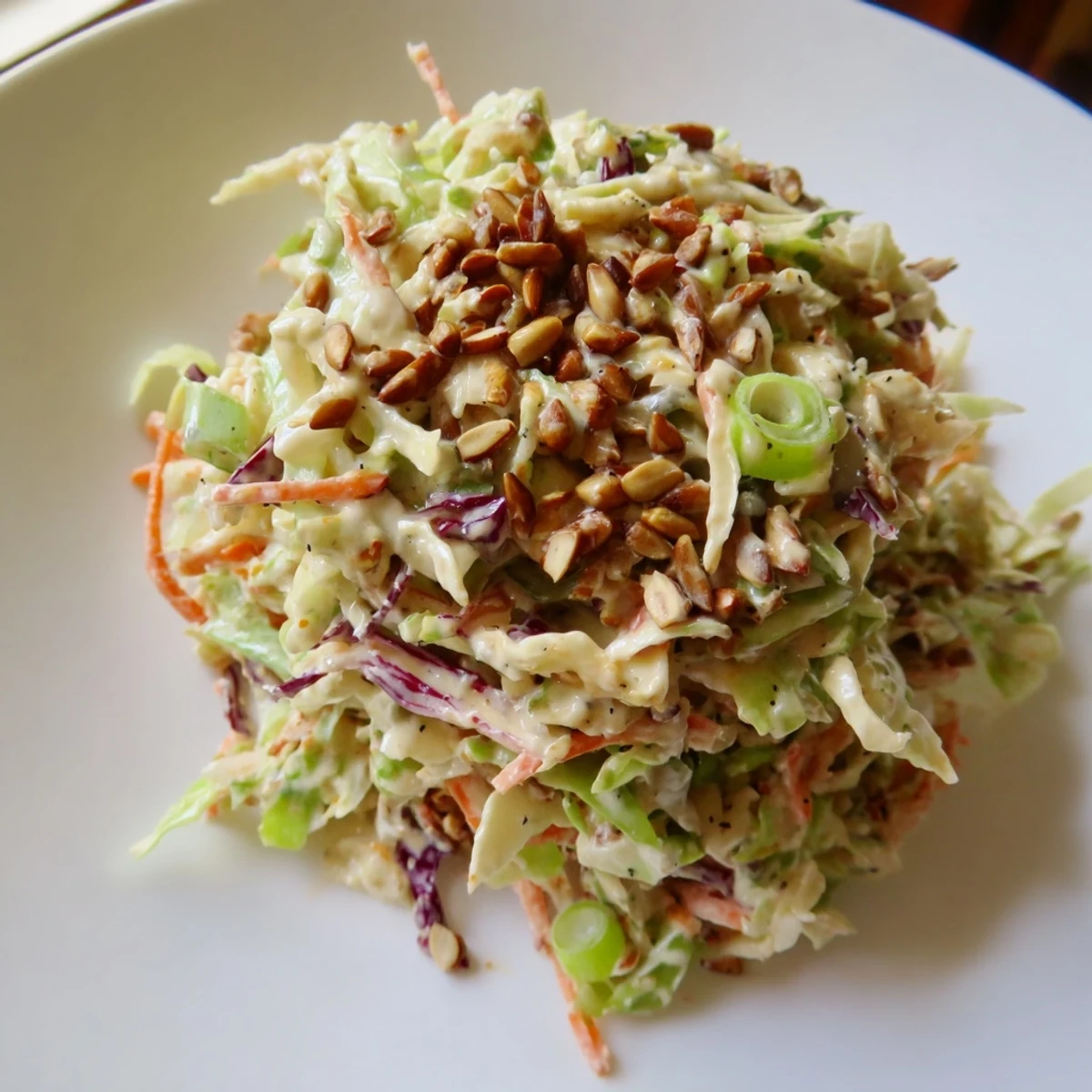 Close-up photo of crunchy coleslaw salad, a perfect side dish with hints of sweetness.