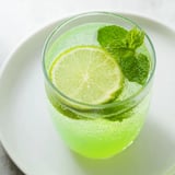 Chilled Mint Lime Agua Fresca sparkles invitingly in a tall glass, perfect for a sunny afternoon.