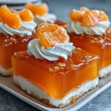 Refreshing Mandarin Orange Creamsicle Jello Salad, chilled and layered with fluffy creaminess.