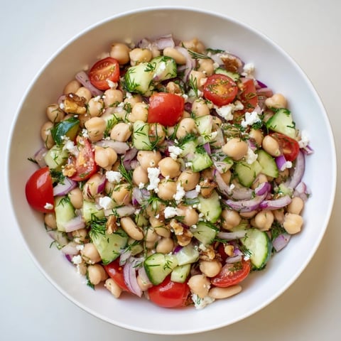 Vibrant, colorful Dense Bean Salad with Sleepy Girl Mocktail Dressing, ready to serve with optional feta.