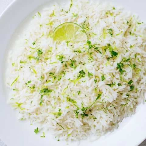 A vibrant bowl of Cilantro Lime Rice, cooked to fluffy perfection, ready to serve and enjoy.