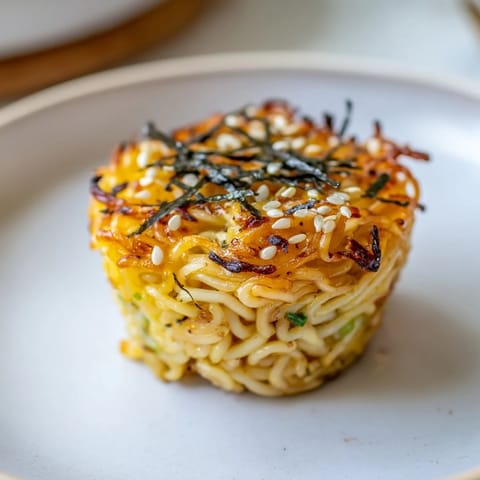 Deliciously baked Japanese Ramen Egg Muffins topped with sesame seeds and nori flakes.  