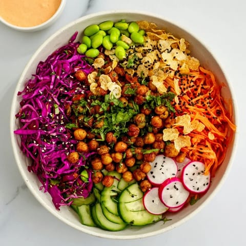 Vibrant snack bowls showcasing earthy chickpeas and rainbow carrots for texture delight.  
