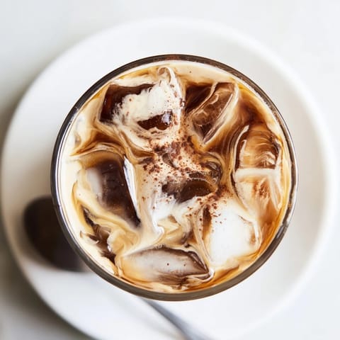 Indulge in this nutty tahini iced coffee topped with refreshing ice cubes.  