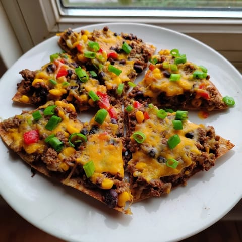Easy sheet pan quesadillas with seasoned beef, featuring melted cheese and crispy tortillas.