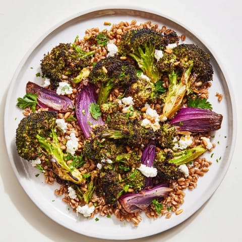 Warm Roasted Broccoli with garlic-lemon on a farro base, perfect vegetarian meal, colorful and vibrant.