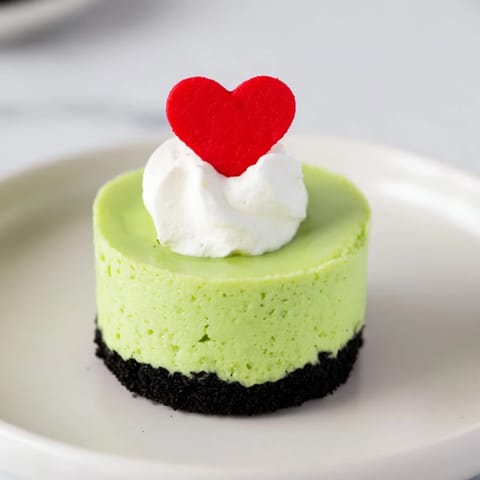 These individual Grinch Mini Cheesecakes are creamy, rich, and perfect for your holiday celebration.