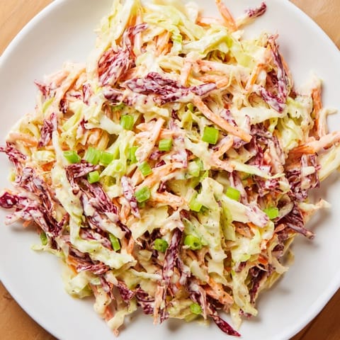 Easy-to-make Quick Coleslaw Salad recipe, featuring crunchy vegetables drenched in a tangy sauce.