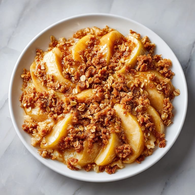 Imagine the sweet aroma: freshly baked Warm Ginger-Cinnamon Pear Crumble, with a buttery, crunchy crumble.