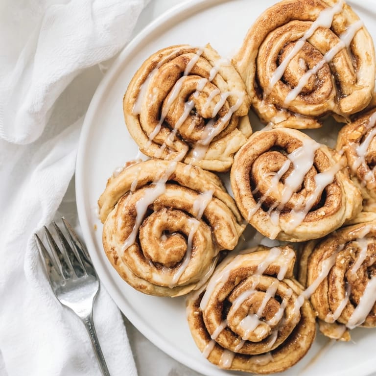 Warm Peanut Butter Cinnamon Roll cookies baking, promising a rich, peanut-buttery, cinnamon-infused treat.
