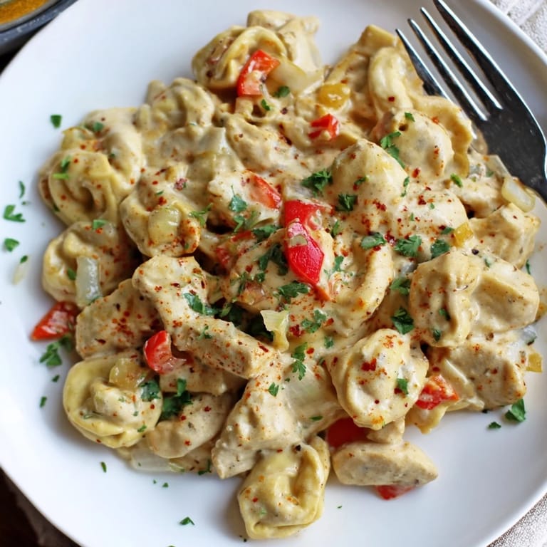Delicious Zesty Cajun Garlic Parmesan Chicken Tortellini, rich and comforting for dinner.
