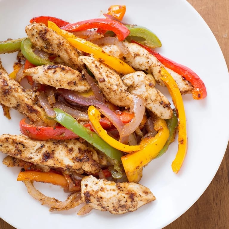 Savory Sheet-Pan Chicken Fajitas: juicy chicken and veggies roasted with vibrant spices for a quick, flavorful meal.