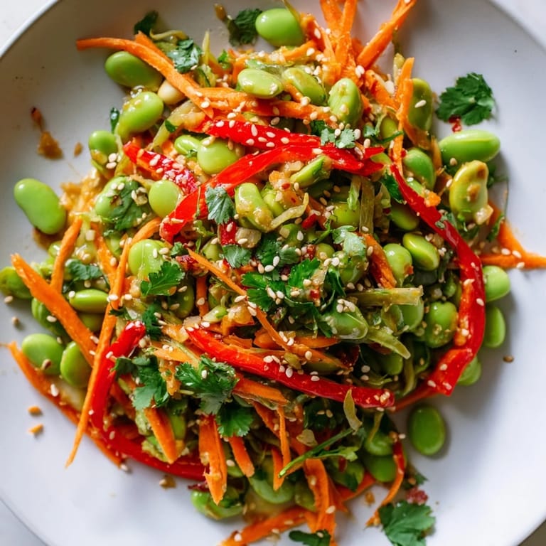 Close-up of a colorful Asian Edamame Salad with toasted sesame seeds for a crunchy bite.